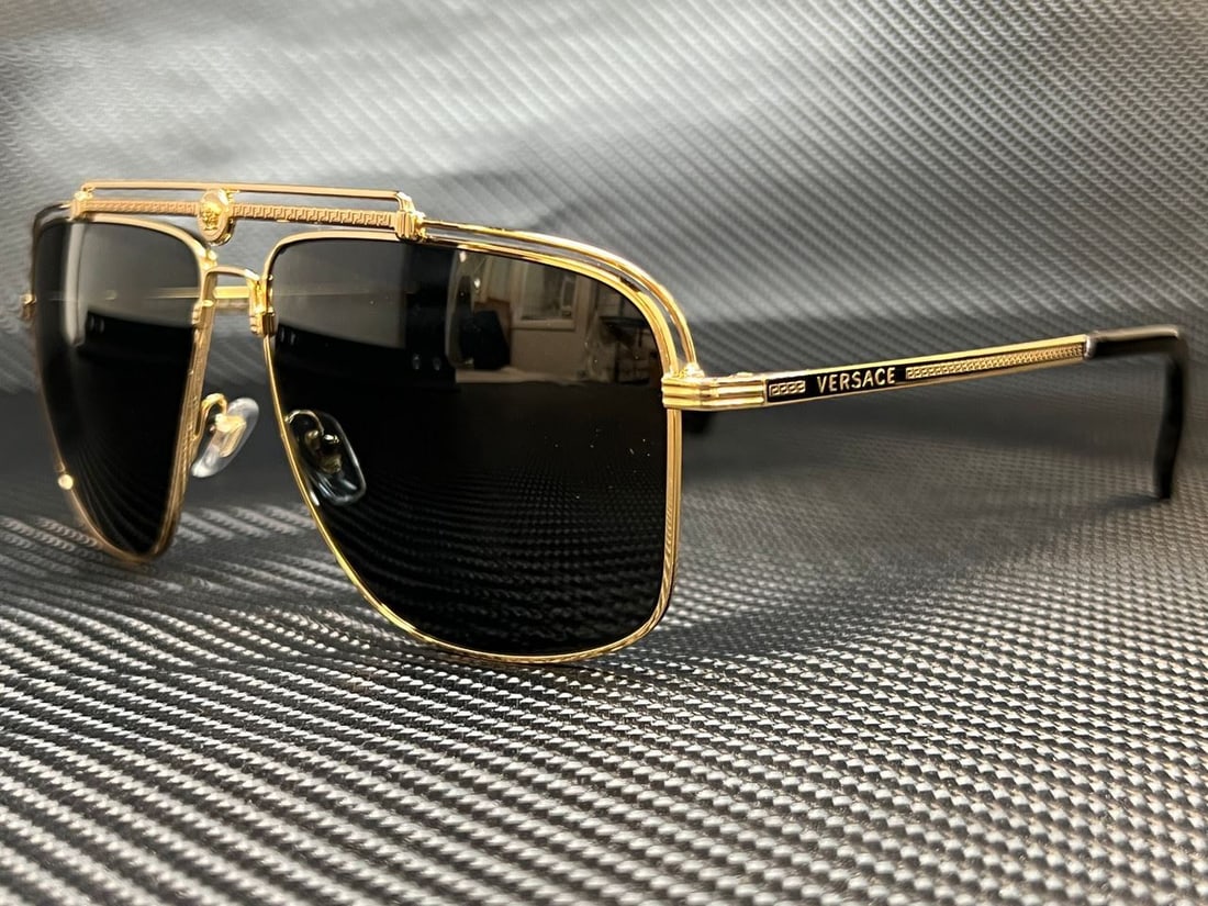 Versace VE2242 100287 Gold Rectangle Sunglasses with Dark Grey Lenses: Versace VE2242 100287 Gold Rectangle Sunglasses with Dark Grey Lenses Elevate your style with these Versace VE2242 100287 sunglasses. Featuring a luxurious gold metal frame, these rectangle sunglasses