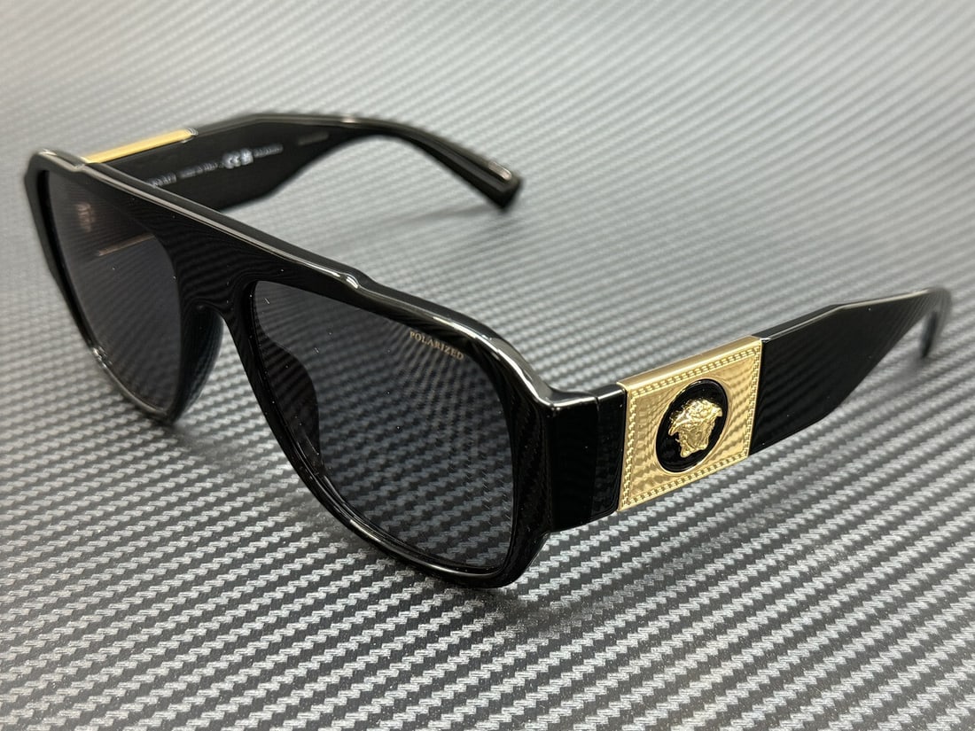 Versace VE4436U GB1 81 Black Frame Grey Polarized Sunglasses with Authenticity: Versace VE4436U GB1 81 Black Frame Grey Polarized Sunglasses with Authenticity Introducing the Versace VE4436U GB1 81 Sunglasses, a stylish accessory that combines luxury with functionality. The sleek