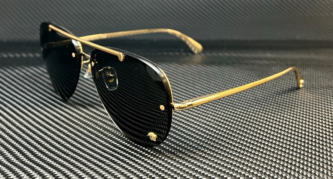 Versace VE2231 Gold Rimless Aviator Sunglasses with Dark Gray Lenses: Versace VE2231 Gold Rimless Aviator Sunglasses with Dark Gray Lenses Elevate your style with these exquisite Versace VE2231 Gold Aviator Sunglasses. Designed for women, these sunglasses feature a stun