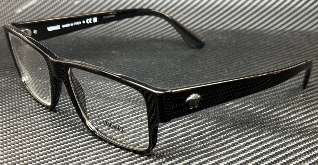 Versace VE3342F GB1 Black Eyeglasses with Authenticity Certificate: Versace VE3342F GB1 Black Eyeglasses with Authenticity Certificate Elevate your eyewear collection with these VERSACE VE3342F GB1 Black Men's Eyeglasses. Crafted with a sleek black frame, these eyegla