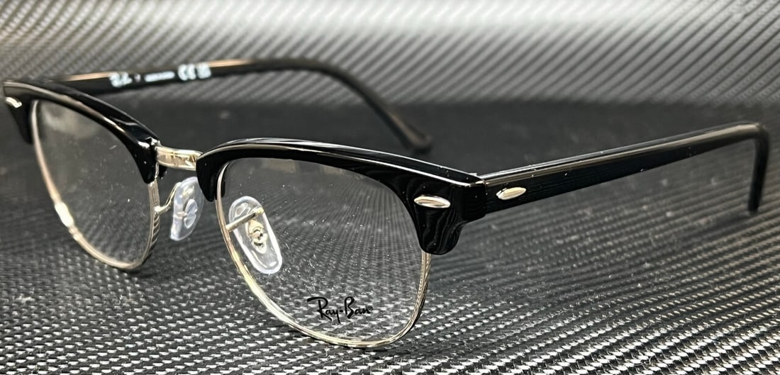 Ray-Ban RX5154 2000 Black Square Unisex Eyeglasses with Case: Ray-Ban RX5154 2000 Black Square Unisex Eyeglasses with Case Introducing the Ray-Ban RX5154 2000 Unisex Eyeglasses, a stylish accessory designed for both fashion and functionality. Featuring a classic