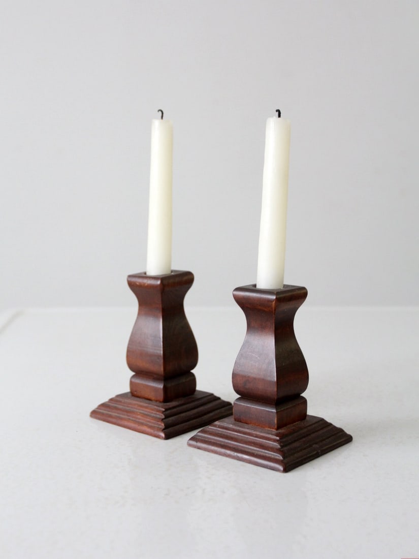 Mid-Century Craftsman Wooden Candlestick Holders Pair: Mid-Century Craftsman Wooden Candlestick Holders Pair This pair of mid-20th century vintage candlestick holders showcases a classic Craftsman style, featuring a deco tapered base and elegant square ba