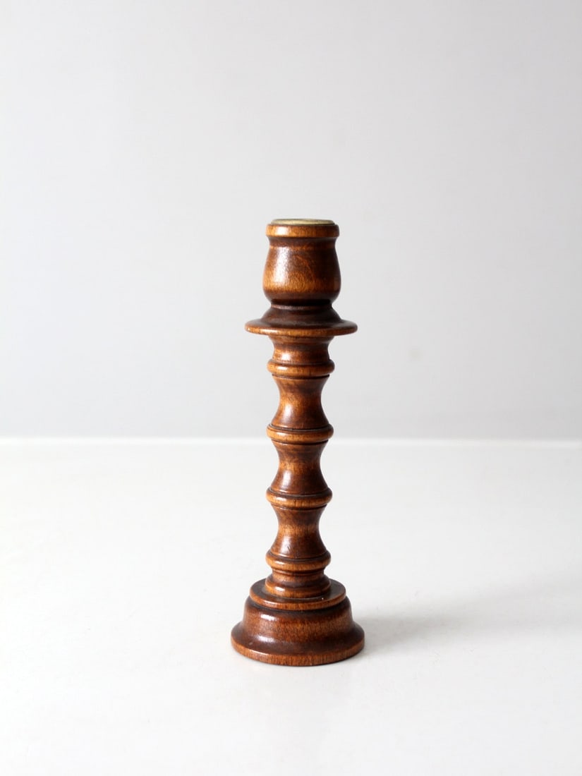 Vintage Turned Wood Candlestick Holder with Brass Sockets: Vintage Turned Wood Candlestick Holder with Brass Sockets Enhance your home decor with this Vintage Turned Wood Candlestick Holder. This elegant wooden holder showcases a classic turned design, comple