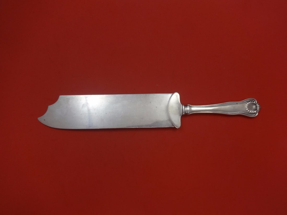 Frank Smith Newport Shell Sterling Silver Ice Cream Slice 12": Frank Smith Newport Shell Sterling Silver Ice Cream Slice 12" This exquisite ice cream slice features a flat handle design crafted from high-quality sterling silver. Made by Frank Smith, it showcases