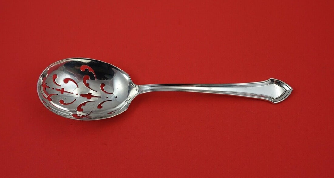 Durgin Essex Sterling Silver Pierced Ice Spoon 8 3/4": Durgin Essex Sterling Silver Pierced Ice Spoon 8 3/4" This exquisite Essex ice spoon by Durgin features a beautiful pierced design, making it a perfect addition to your silverware collection. Crafted