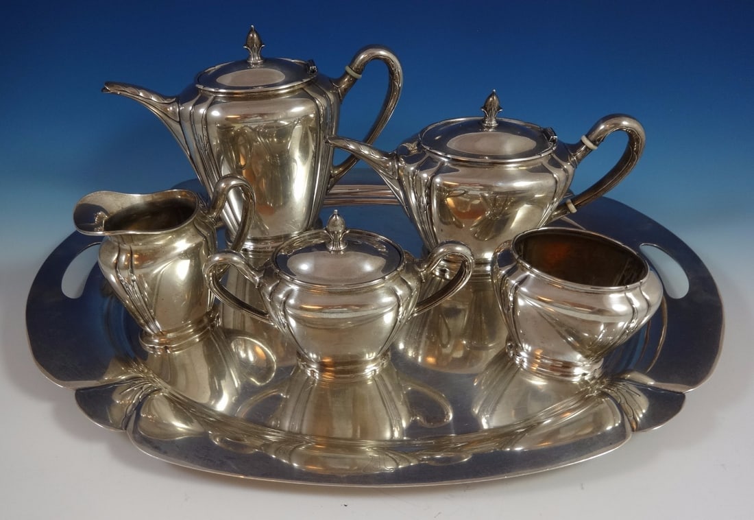 International Silver Orchid 6pc Sterling Silver Tea Set: International Silver Orchid 6pc Sterling Silver Tea Set Enhance your tea service with this exquisite 6-piece tea set from International Sterling, featuring a modernist orchid design. This stunning col