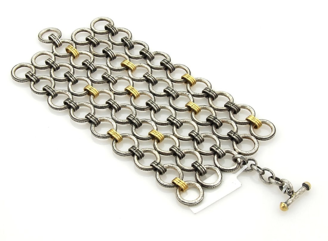 Gurhan Hoopla Sterling Silver 24k Gold Overlay Bracelet 8 Inch: Gurhan Hoopla Sterling Silver 24k Gold Overlay Bracelet 8 Inch The Gurhan Hoopla Sterling Silver & 24k Gold Overlay Circular Wide Bracelet is a stunning piece of jewelry that effortlessly combines ele