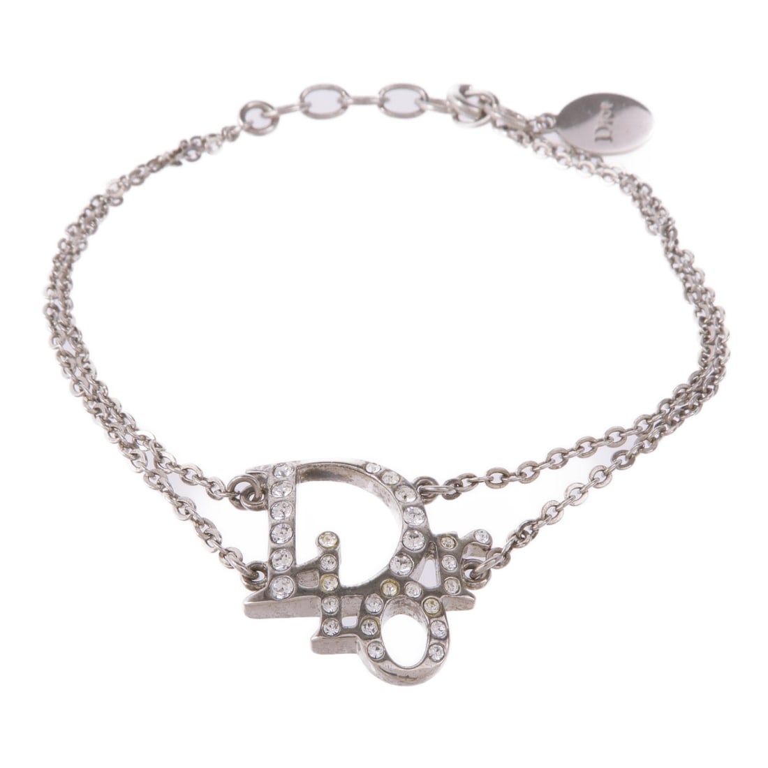 Dior CD Silver Metal Bracelet Made in France: Dior CD Silver Metal Bracelet Made in France This exquisite Christian Dior bracelet showcases a sleek silver tone, embodying the elegance and sophistication synonymous with the Dior brand. Crafted in