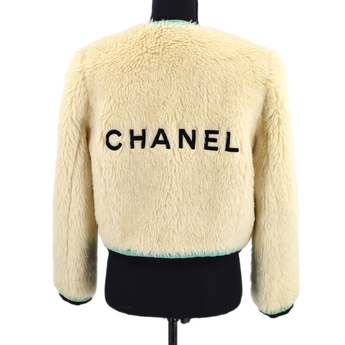 Chanel Off-White Black Fur Jacket Coat with Silk Lining: Chanel Off-White Black Fur Jacket Coat with Silk Lining This elegant Chanel jacket combines luxury with casual sophistication, featuring a striking off-white and black fur design. Crafted from a blend