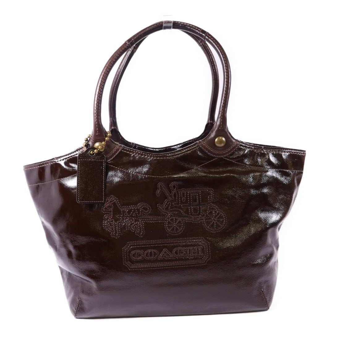 COACH Brown Patent Leather Shoulder Bag Made in USA: COACH Brown Patent Leather Shoulder Bag Made in USA This stylish COACH shoulder bag is crafted from high-quality patent leather in a rich brown color. It features a spacious interior with ample room f