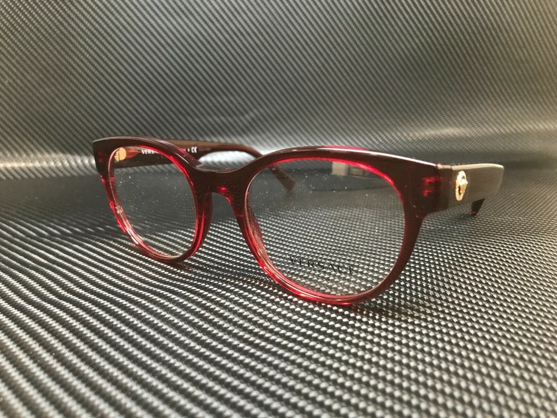 Versace VE3268 388 Transparent Red Round Eyeglasses with Case: Versace VE3268 388 Transparent Red Round Eyeglasses with Case Elevate your eyewear collection with these stylish VERSACE VE3268 388 eyeglasses. Featuring a trendy round frame in a striking transparent