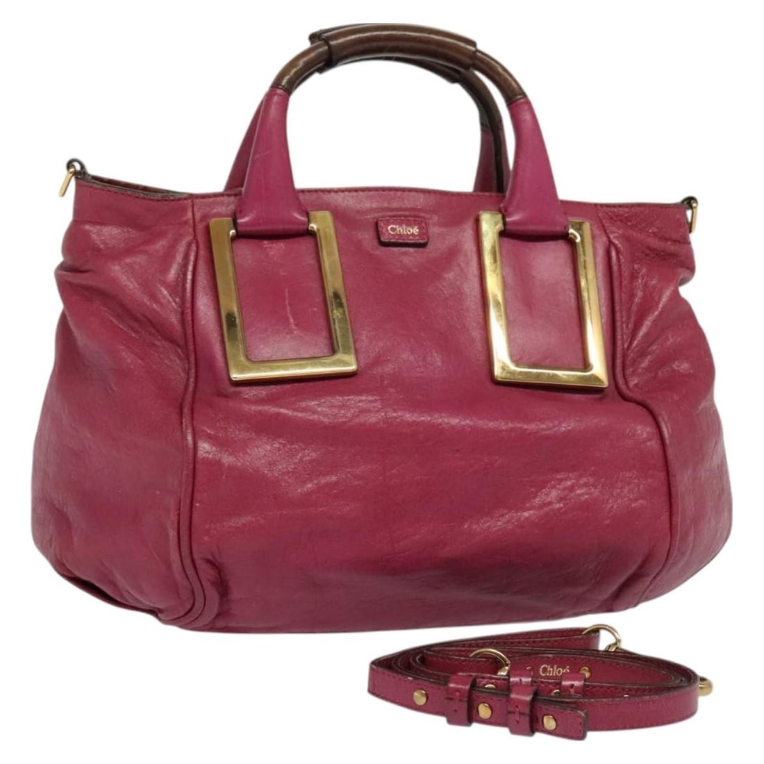 Chloe Etel Leather Hand Bag Pink Gold Authentic 2way BA2946: Chloe Etel Leather Hand Bag Pink Gold Authentic 2way BA2946 Introducing the Chloe Etel Hand Bag, a stylish accessory that embodies luxury and functionality. Crafted from high-quality leather, this bag