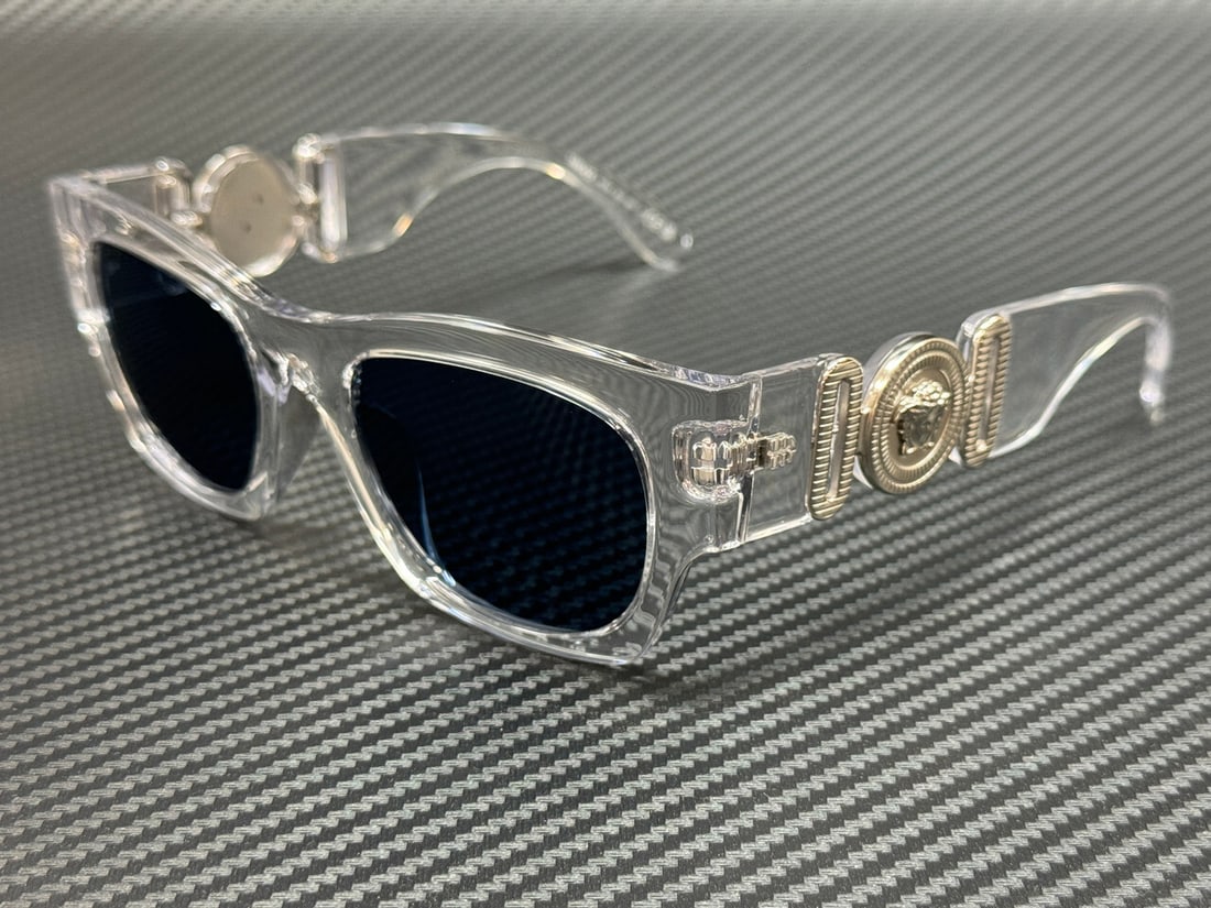 Versace VE4479U 148 80 Crystal Frame Blue Lens Sunglasses: Versace VE4479U 148 80 Crystal Frame Blue Lens Sunglasses Elevate your style with these Versace VE4479U sunglasses, featuring a stunning crystal frame that exudes luxury and sophistication. The blue l