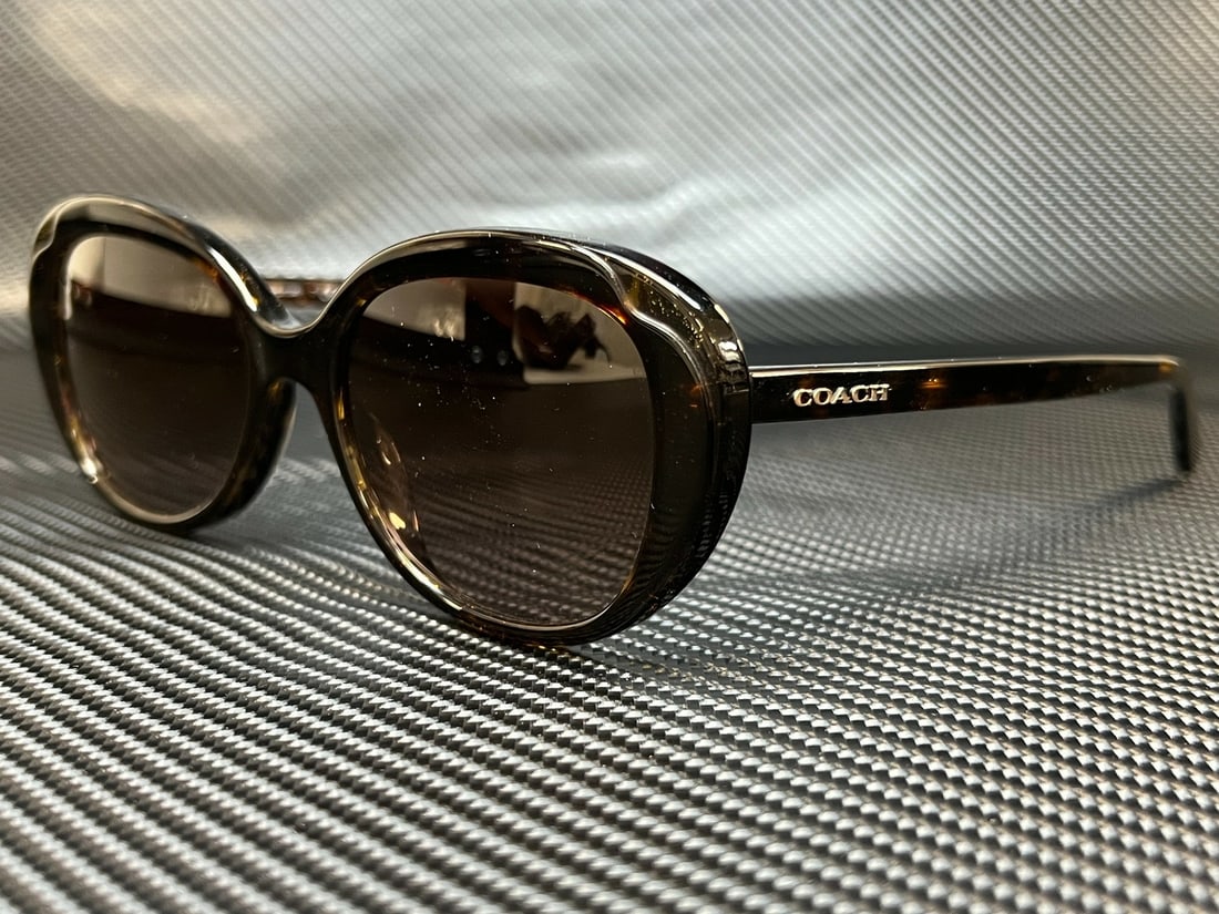 Coach HC8289 Tortoise Glitter Round Sunglasses with Brown Gradient Lenses: Coach HC8289 Tortoise Glitter Round Sunglasses with Brown Gradient Lenses Elevate your style with these COACH HC8289 sunglasses. Designed for women, these chic round sunglasses feature a tortoise glit