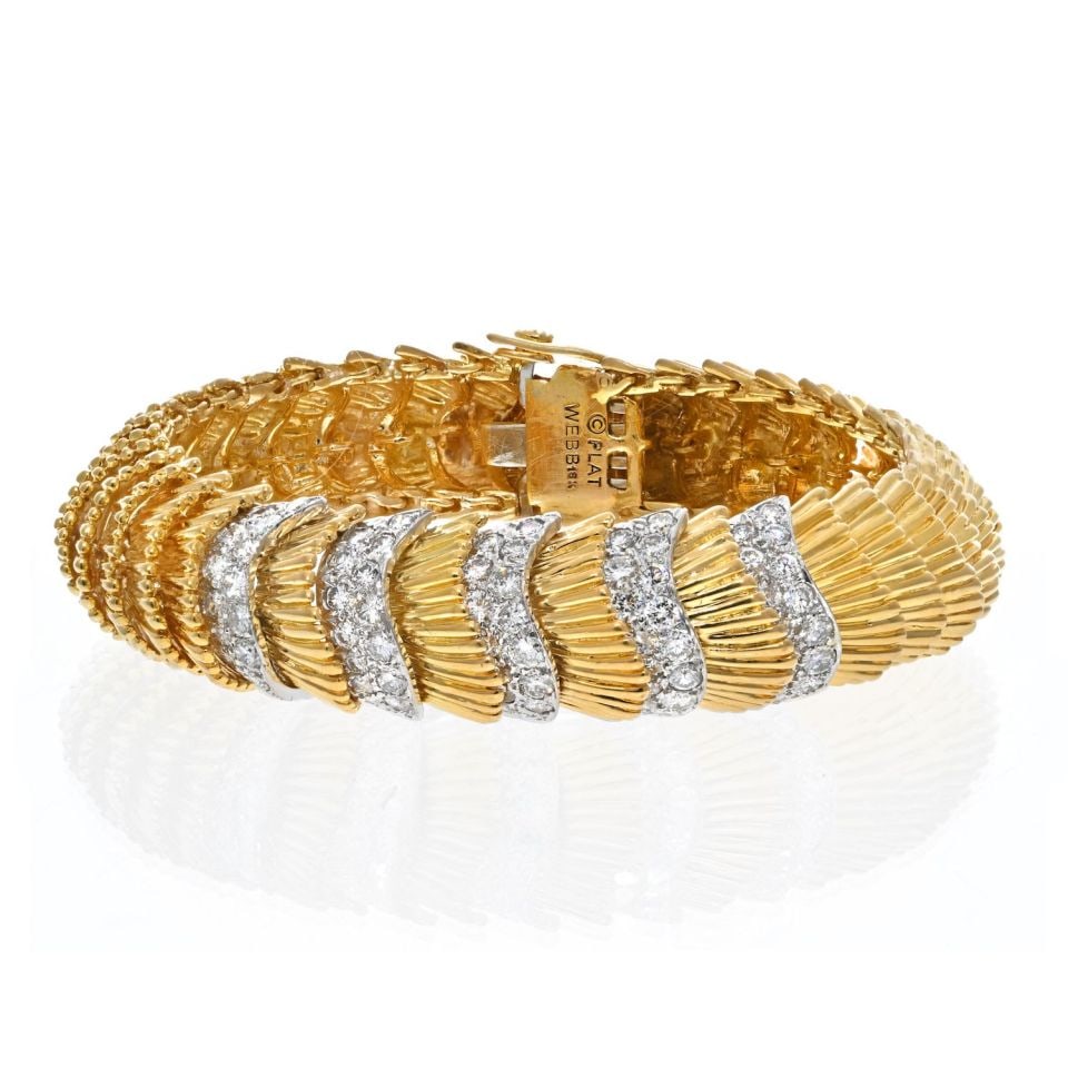 David Webb Platinum 18K Yellow Gold Diamond Bracelet 5.75 Cts: David Webb Platinum 18K Yellow Gold Diamond Bracelet 5.75 Cts This exquisite vintage bracelet by David Webb showcases a stunning combination of platinum and 18K yellow gold. Crafted with flexible rows