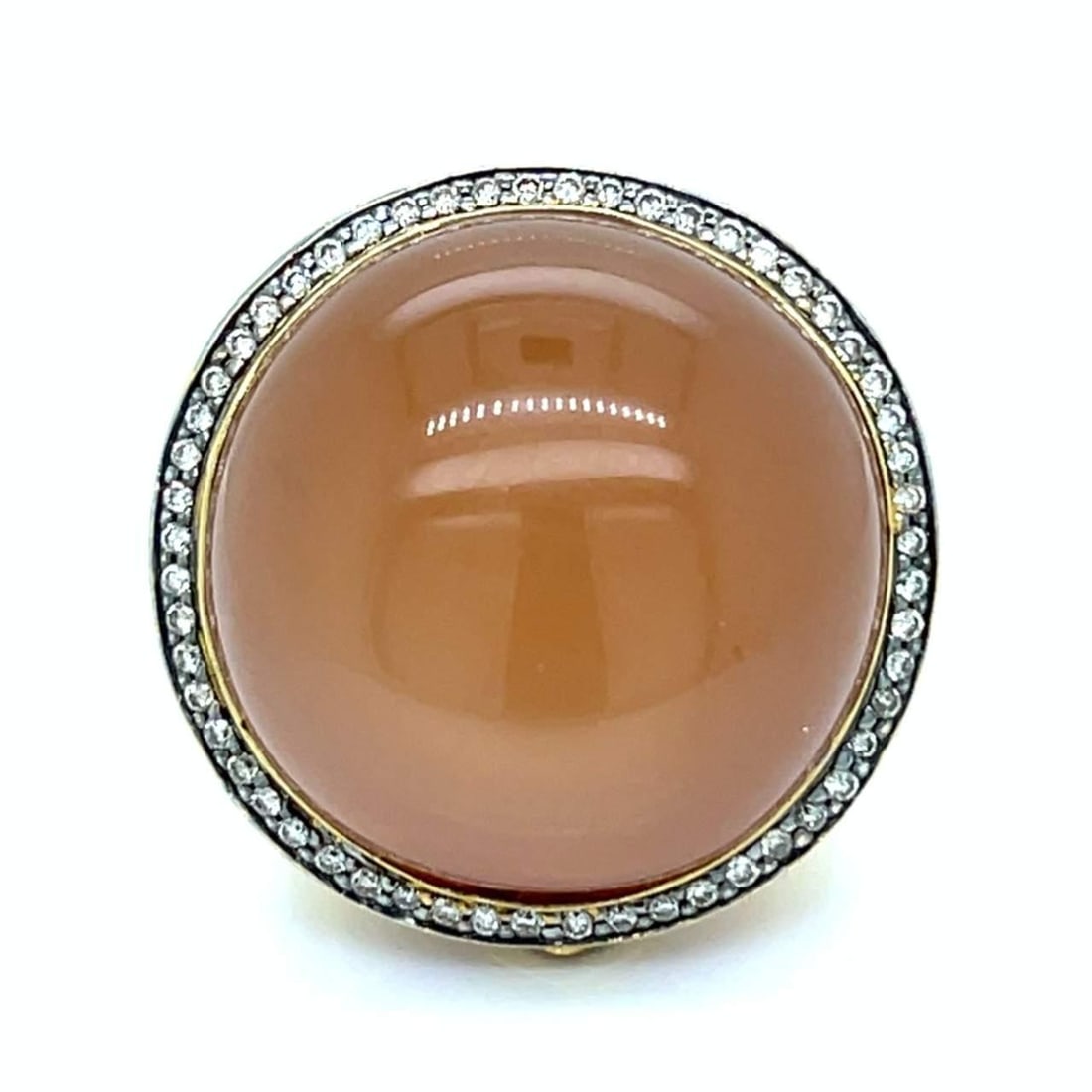 Stunning 18K Yellow Gold Moonstone Diamond Sapphire Ring: Stunning 18K Yellow Gold Moonstone Diamond Sapphire Ring This stunning 18K Yellow Gold Ring features a captivating Moonstone at approximately 40.00 Ct, complemented by approximately 0.80 Ct of sparkli