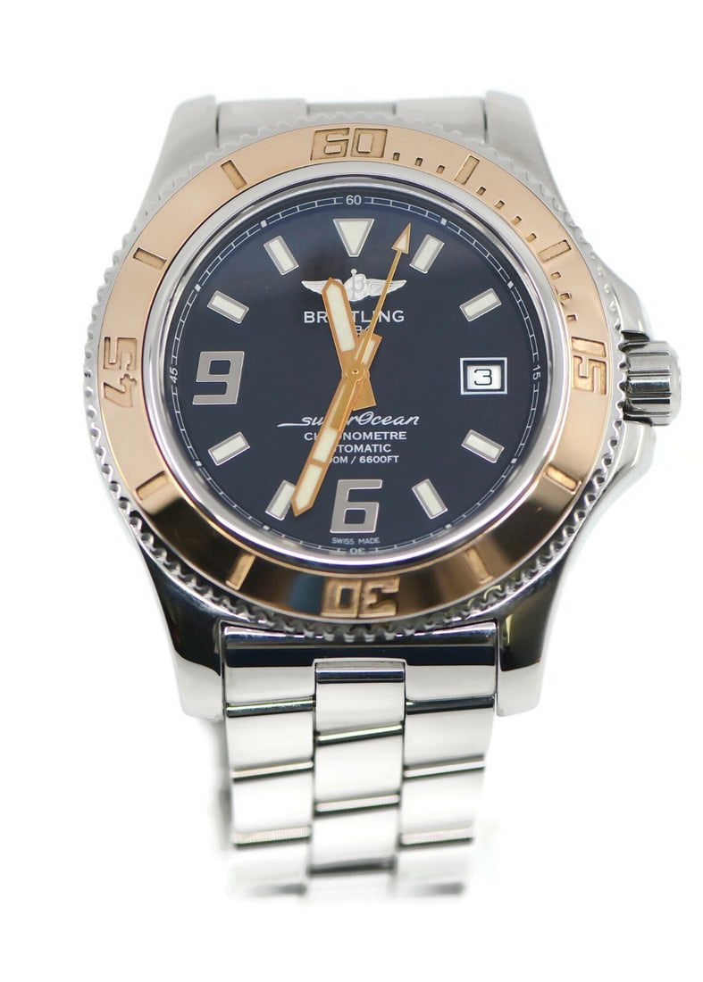 Breitling Superocean 18K Gold Stainless Steel Watch with Box and Papers: Breitling Superocean 18K Gold Stainless Steel Watch with Box and Papers Discover the exquisite Breitling Superocean watch, a perfect blend of luxury and performance. Crafted with a stunning 18K gold a