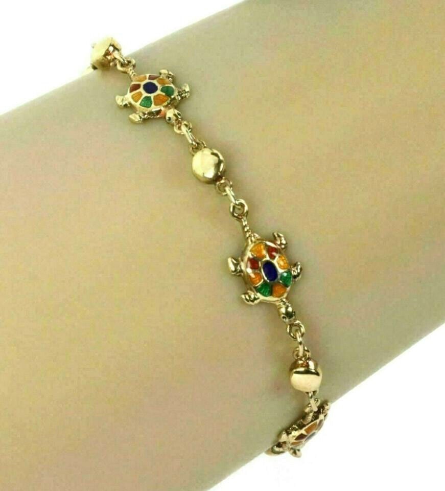 Vintage Multi-Color Enamel Turtle Charm 14k Yellow Gold Bracelet: Vintage Multi-Color Enamel Turtle Charm 14k Yellow Gold Bracelet This stunning Multi-Color Enamel Turtle 14k Yellow Gold Charms Bead Bracelet is a perfect blend of elegance and playful design. Crafted