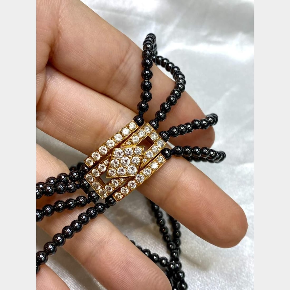 Van Cleef & Arpels 18K Gold Hematite Diamond Necklace Bracelet Set: Van Cleef & Arpels 18K Gold Hematite Diamond Necklace Bracelet Set This exquisite Van Cleef & Arpels necklace and bracelet set features a stunning combination of 18K gold and hematite. The set is ador