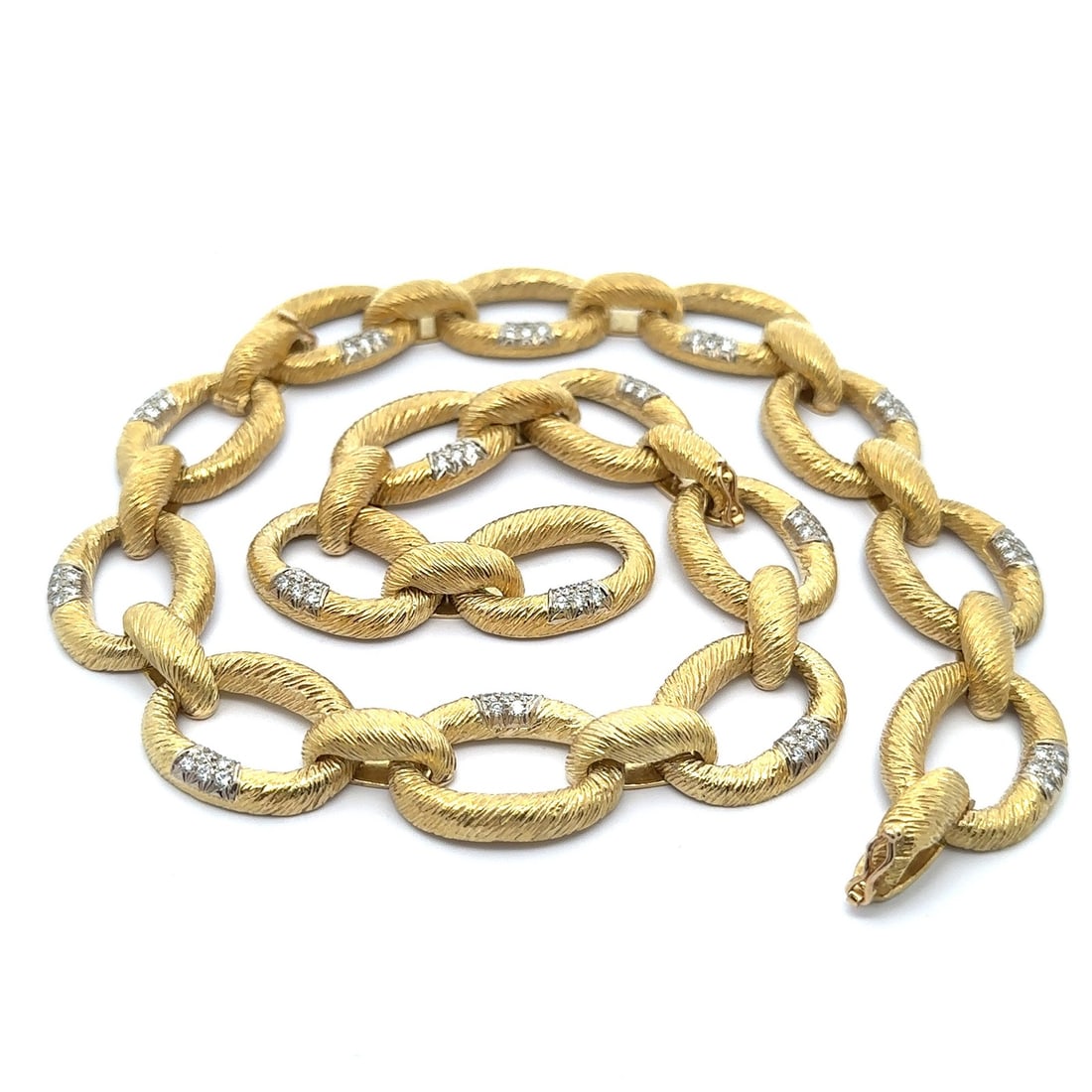 18k Yellow Gold 3ctw Diamond Textured Open Oval Link Necklace & Bracelets: 18k Yellow Gold 3ctw Diamond Textured Open Oval Link Necklace & Bracelets This stunning piece is a versatile 3-in-1 jewelry item that can be worn as three elegant bracelets or a long necklace. Crafted