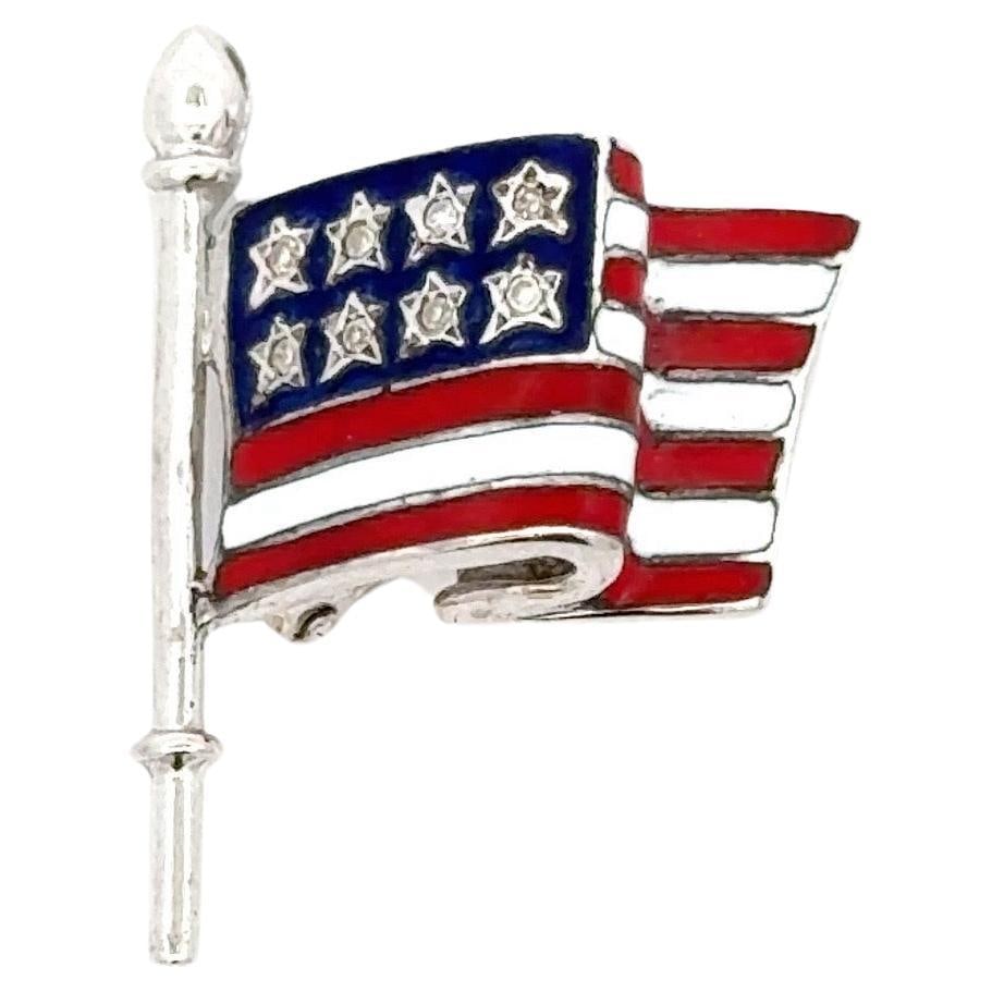 14K White Gold American Flag Brooch with 8 Diamonds and Enamel: 14K White Gold American Flag Brooch with 8 Diamonds and Enamel This exquisite American Flag brooch is crafted from 14 karat white gold and features vibrant red, white, and blue enamel detailing. Adorn