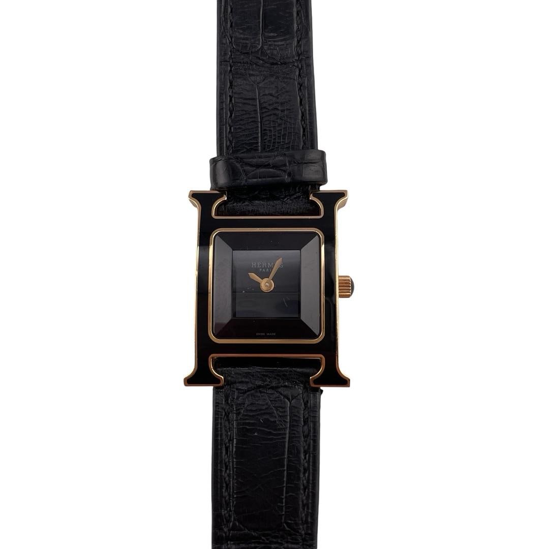 Hermes H Ladies Watch Black Dial Leather Ref HH1.270B with Warranty Papers: Hermes H Ladies Watch Black Dial Leather Ref HH1.270B with Warranty Papers This exquisite Hermes H watch features a striking black dial, designed specifically for ladies. The timepiece is part of the