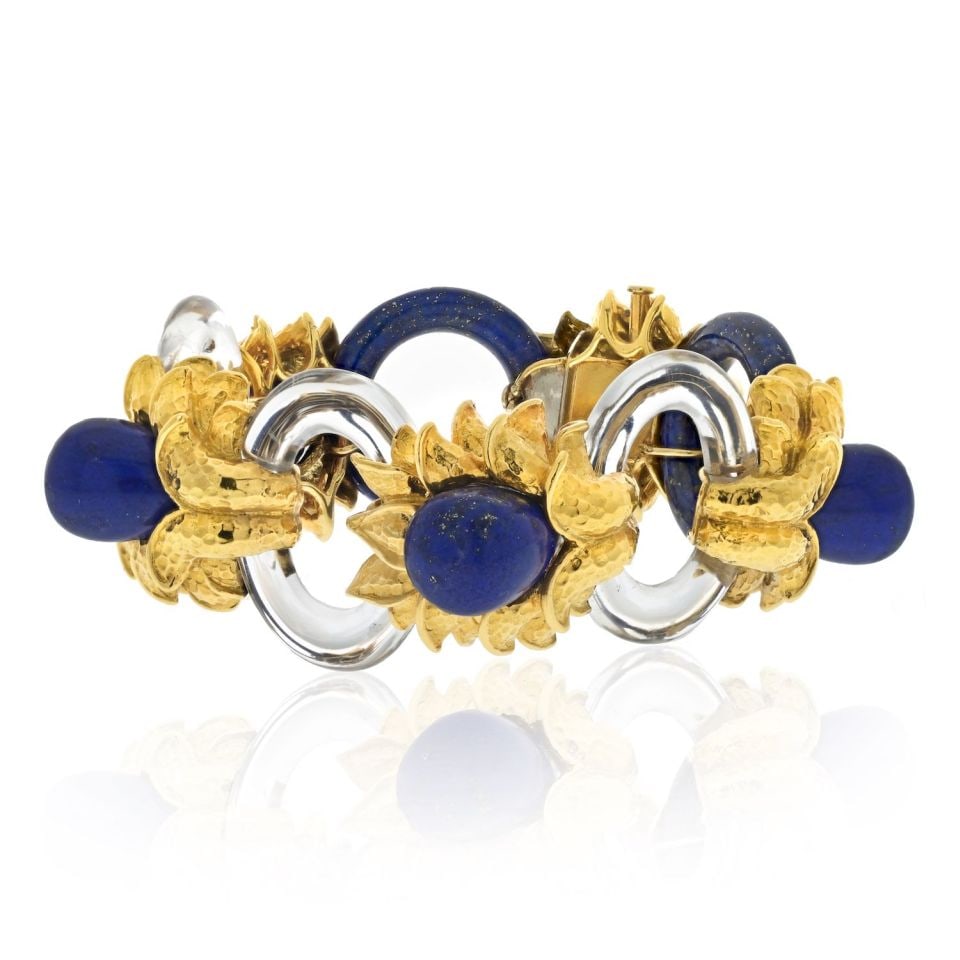 David Webb Floral Bracelet in Platinum & 18K Yellow Gold with Rock Crystal & Lapis: David Webb Floral Bracelet in Platinum & 18K Yellow Gold with Rock Crystal & Lapis This exquisite bracelet combines the luxury of platinum and 18K yellow gold, showcasing a masterful design by David W