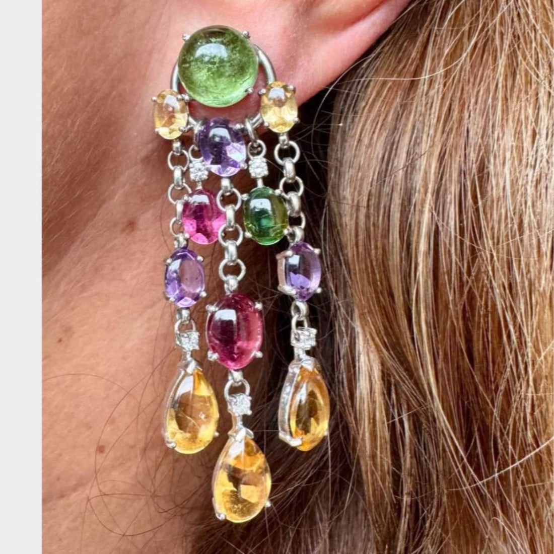 18K Yellow Gold Certified Gemstone Earrings with Diamonds: 18K Yellow Gold Certified Gemstone Earrings with Diamonds Elevate your elegance with these stunning 18K Yellow Gold earrings, featuring a vibrant array of colored stones. These eye-catching earrings a