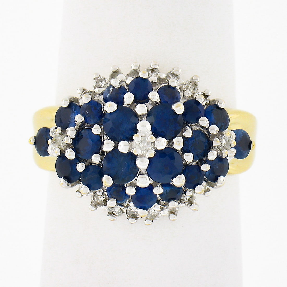 14K Two Tone Gold 2.0ctw Royal Blue Sapphire Diamond Cocktail Cluster Ring: 14K Two Tone Gold 2.0ctw Royal Blue Sapphire Diamond Cocktail Cluster Ring This stunning cocktail ring showcases a beautiful tiered cluster design featuring natural royal blue sapphires and sparkling