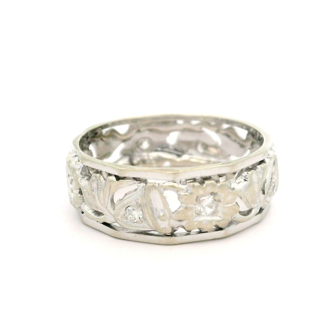 Vintage Retro 14k White Gold Diamond Floral Ring 0.12ctw: Vintage Retro 14k White Gold Diamond Floral Ring 0.12ctw This exquisite Vintage Retro Gold Diamond Floral & Bells Open Work Center Faceted Edges Band showcases a delicate floral design enriched with n
