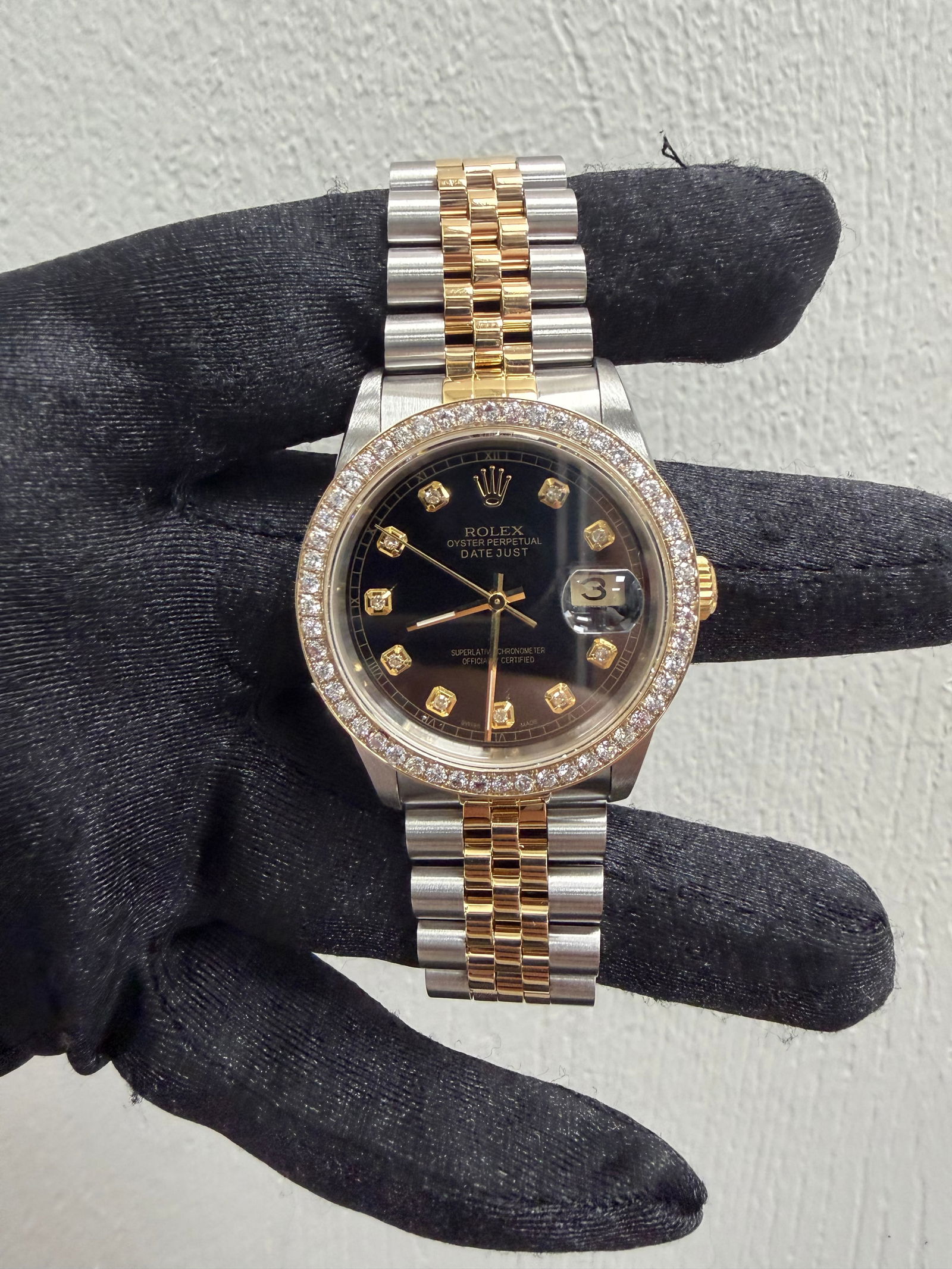 Rolex Datejust 16233 Black Diamond Dial Jubilee with Papers 1991: Rolex Datejust 16233 Black Diamond Dial Jubilee with Papers 1991 This exquisite Rolex Datejust features a striking Aftermarket Black Diamond dial, perfectly complemented by a fluted bezel and a Jubile