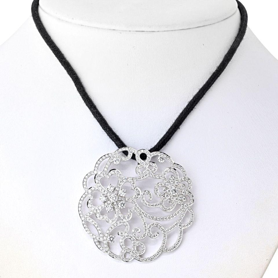 Van Cleef & Arpels 18K White Gold Dentelle Diamond Pendant Silk Cord: Van Cleef & Arpels 18K White Gold Dentelle Diamond Pendant Silk Cord This exquisite pendant from the Van Cleef & Arpels Dentelle collection is crafted in 18K white gold, featuring a delicate round ope