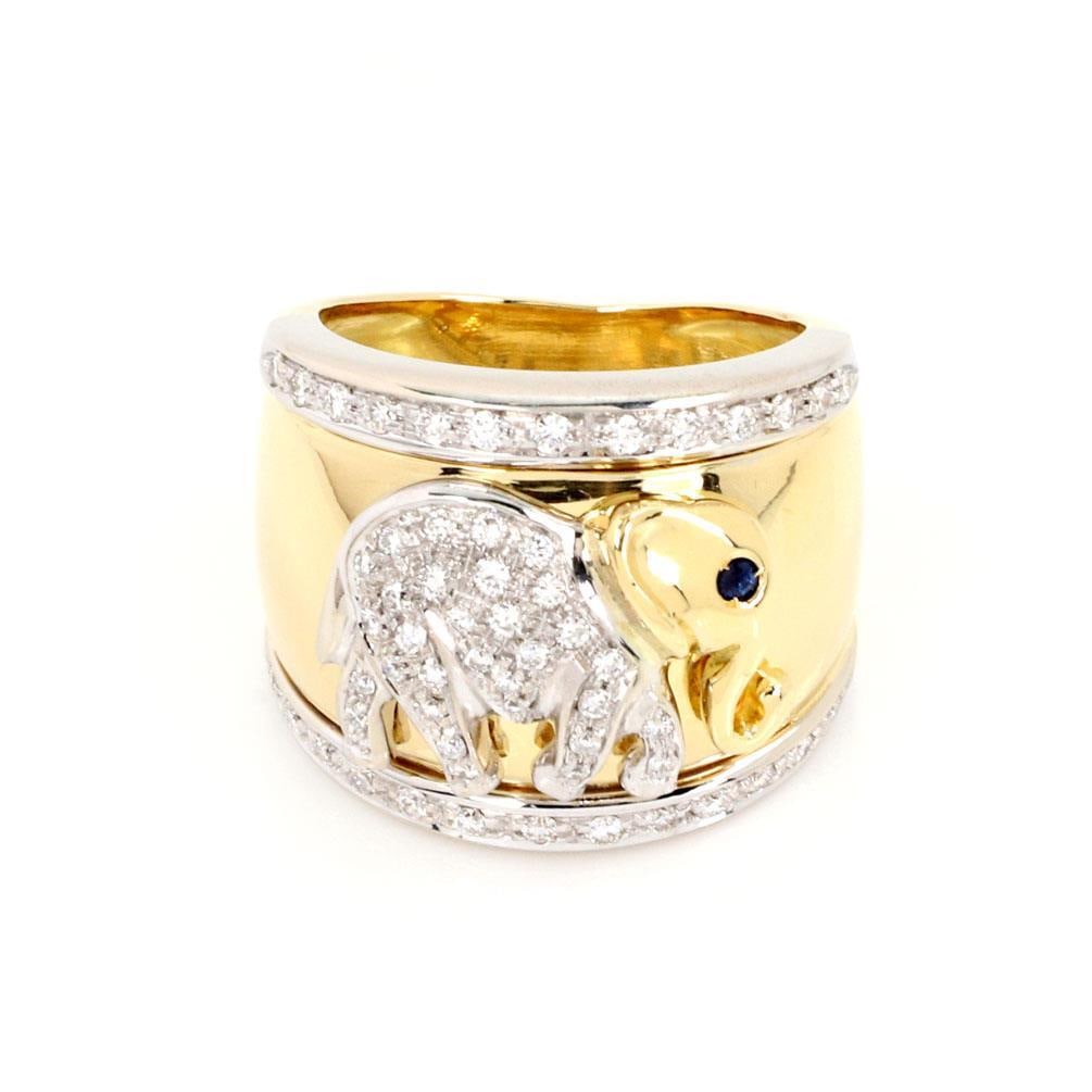 18k Two Tone Gold Elephant Ring with Diamonds and Blue Gem Size 5: 18k Two Tone Gold Elephant Ring with Diamonds and Blue Gem Size 5 This exquisite wide dome ring showcases a unique design crafted from 18k yellow and white gold. The ring features a high polished fini