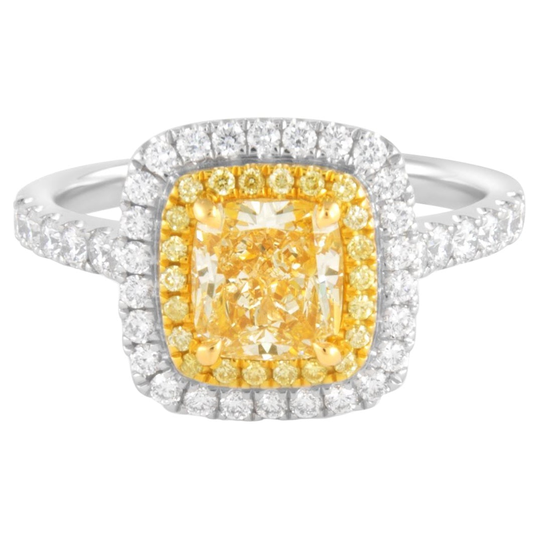 1.13ct Cushion Fancy Yellow Diamond Ring 18k Two-Tone EGL Certified: 1.13ct Cushion Fancy Yellow Diamond Ring 18k Two-Tone EGL Certified This exquisite ring showcases a stunning 1.13 carat cushion cut fancy light yellow diamond with VS1 clarity, certified by EGL (Repor