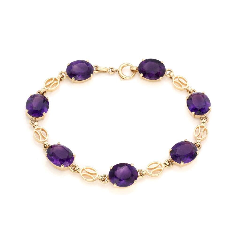 Vintage 14k Yellow Gold 7 Oval Amethyst Link Bracelet: Vintage 14k Yellow Gold 7 Oval Amethyst Link Bracelet This exquisite vintage bracelet features a stunning design crafted from 14k yellow gold. It showcases seven large oval-cut amethyst gemstones, eac