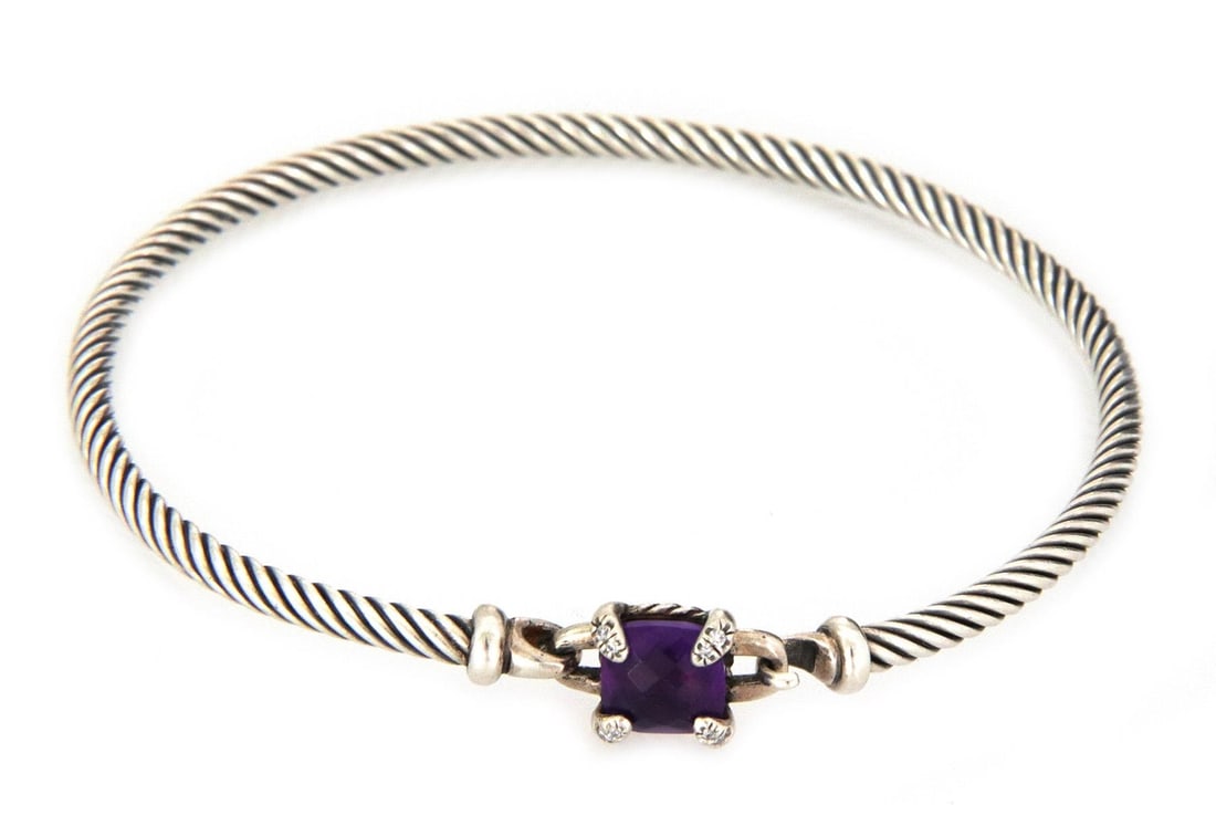 David Yurman Sterling Silver Bangle Amethyst Diamond Hook Clasp: David Yurman Sterling Silver Bangle Amethyst Diamond Hook Clasp This exquisite David Yurman bangle showcases a blend of elegance and sophistication. Crafted from high-quality sterling silver, it featu