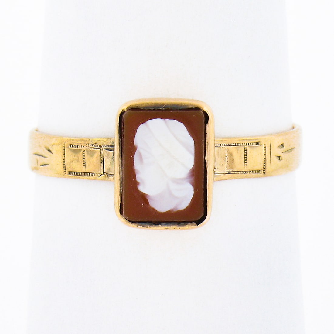 Antique Victorian 10k Gold Carved Agate Cameo Ring: Antique Victorian 10k Gold Carved Agate Cameo Ring This exquisite antique Victorian ring features a stunning 10k yellow gold construction and showcases a petite, rectangular carved agate at its center