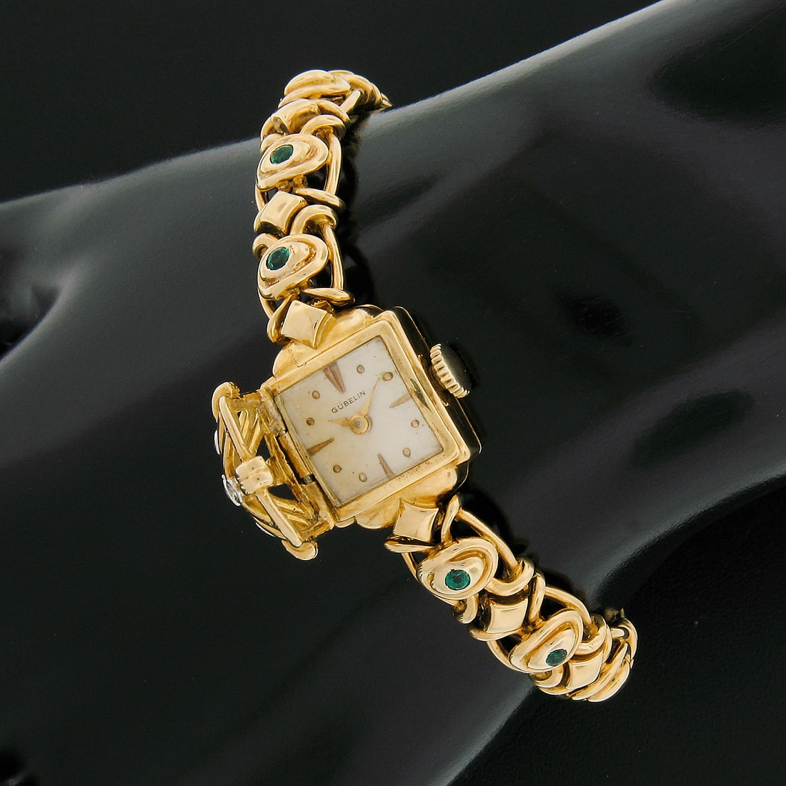 Vintage Gubelin 14mm 18k Gold Diamond Emerald Link Bracelet Watch: Vintage Gubelin 14mm 18k Gold Diamond Emerald Link Bracelet Watch This exquisite vintage Gubelin wristwatch showcases a 14mm square case crafted from solid 18k yellow gold, featuring a diamond-encrust