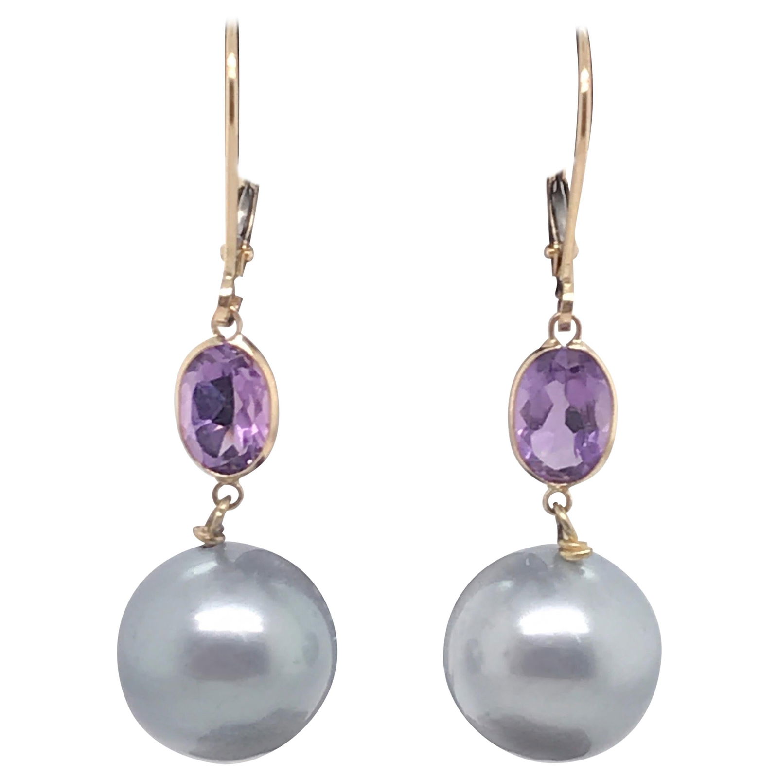 Harbor Diamonds 14K Yellow Gold Amethyst Tahitian Pearl Drop Earrings: Harbor Diamonds 14K Yellow Gold Amethyst Tahitian Pearl Drop Earrings Elevate your style with these stunning drop earrings, crafted from 14K yellow gold. Each earring features two exquisite oval-cut a