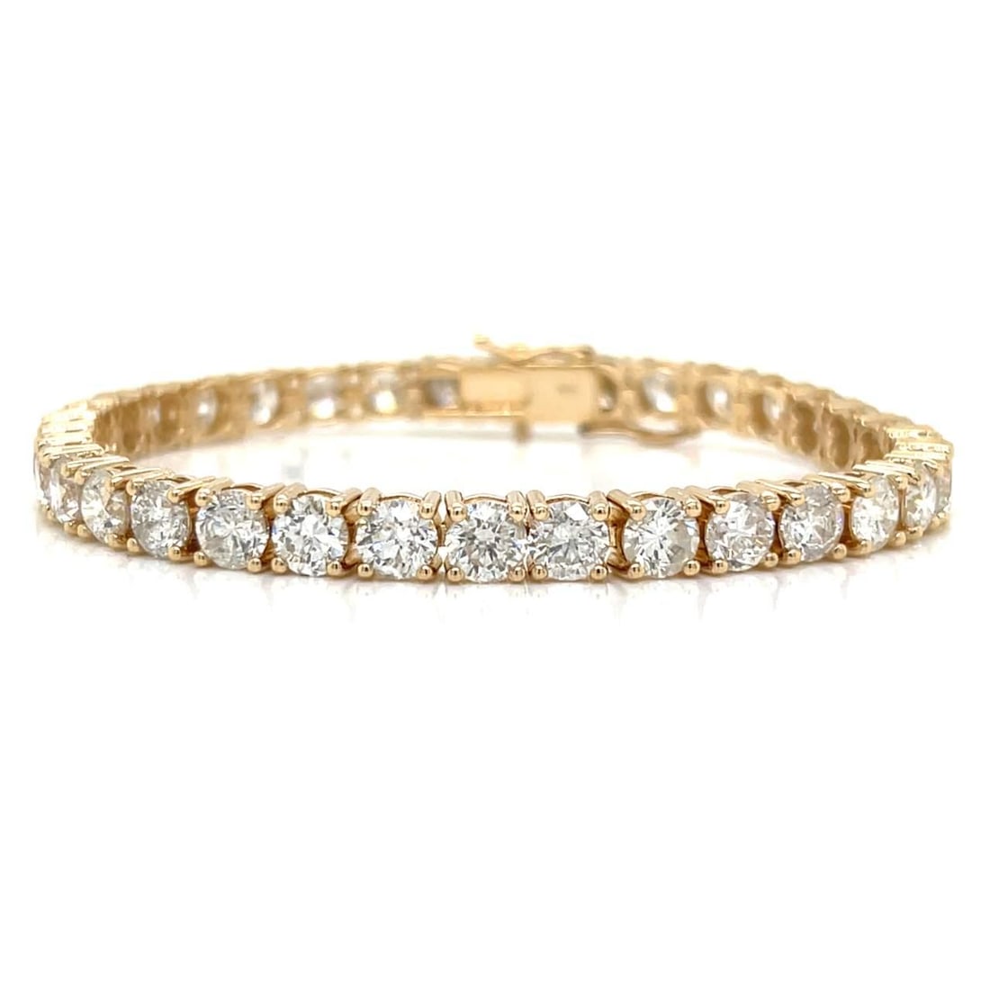 Elegant 14K Yellow Gold Diamond Tennis Bracelet 17.00 Ct 34 Diamonds: Elegant 14K Yellow Gold Diamond Tennis Bracelet 17.00 Ct 34 Diamonds This exquisite 14K yellow gold tennis bracelet features a stunning array of 34 diamonds totaling approximately 17.00 carats. The di