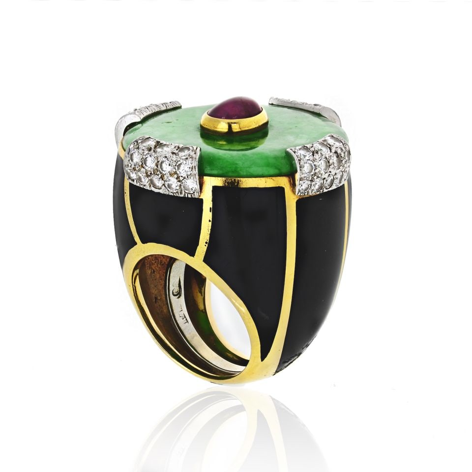 David Webb Jade Ruby Diamond Ring in Platinum and 18K Gold: David Webb Jade Ruby Diamond Ring in Platinum and 18K Gold This exquisite estate ring by David Webb showcases a stunning jade disc at its center, beautifully accented by a bezel-set cabochon ruby and