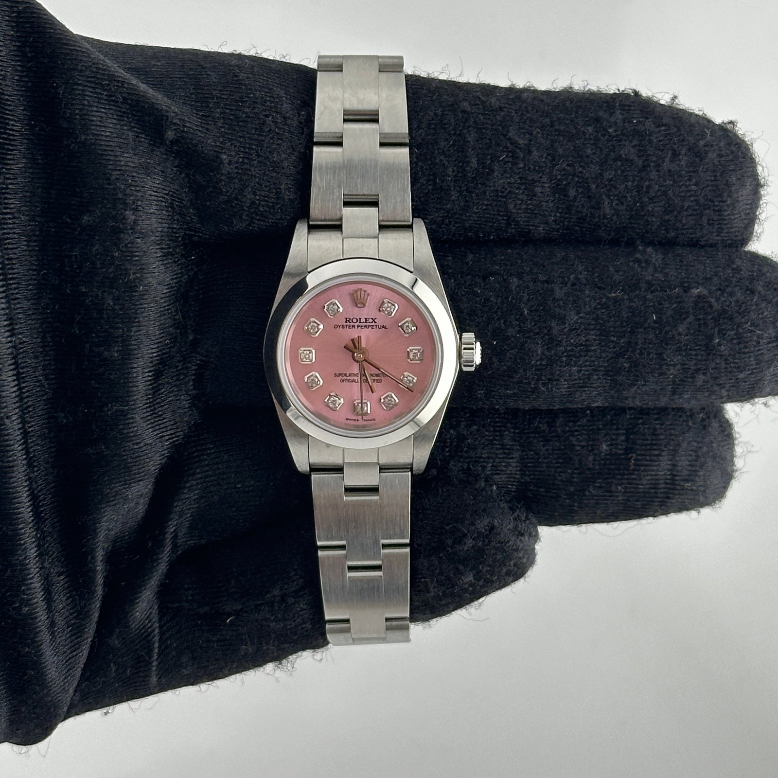 Rolex Oyster Perpetual 76080 Ladies Pink Diamond Dial: Rolex Oyster Perpetual 76080 Ladies Pink Diamond Dial This exquisite Rolex Oyster Perpetual features a stunning Aftermarket Pink Diamond dial, perfectly designed for ladies. With a smooth bezel and an