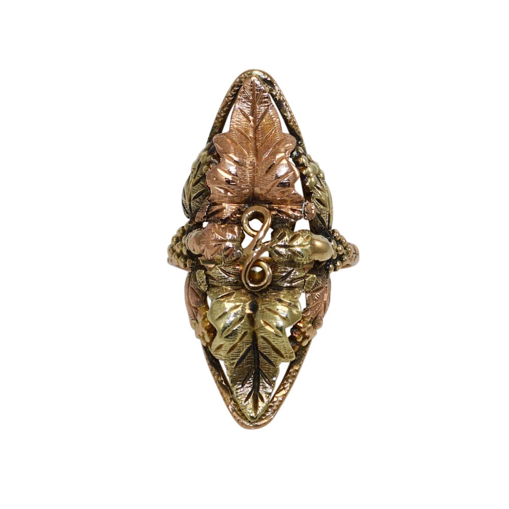 10K Vintage Two-Tone Leaf Design Ring Unbranded: 10K Vintage Two-Tone Leaf Design Ring Unbranded This exquisite vintage ring showcases a stunning leaf design crafted in 10K two-tone gold, featuring both yellow and rose gold elements. The intricate d