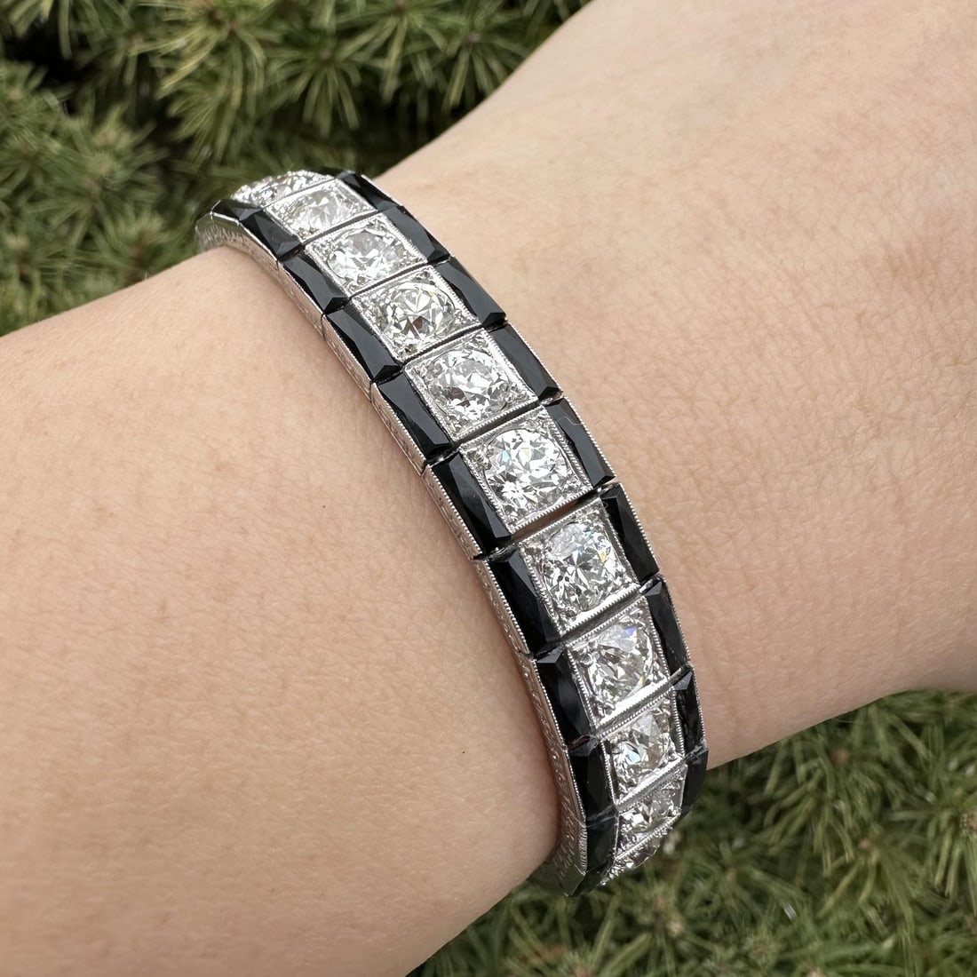 Antique Art Deco Platinum 8ct Old Cut Diamond Onyx Bracelet: Antique Art Deco Platinum 8ct Old Cut Diamond Onyx Bracelet This elegant antique Art Deco bracelet showcases a stunning combination of old cut diamonds and black onyx. Crafted from solid platinum, the