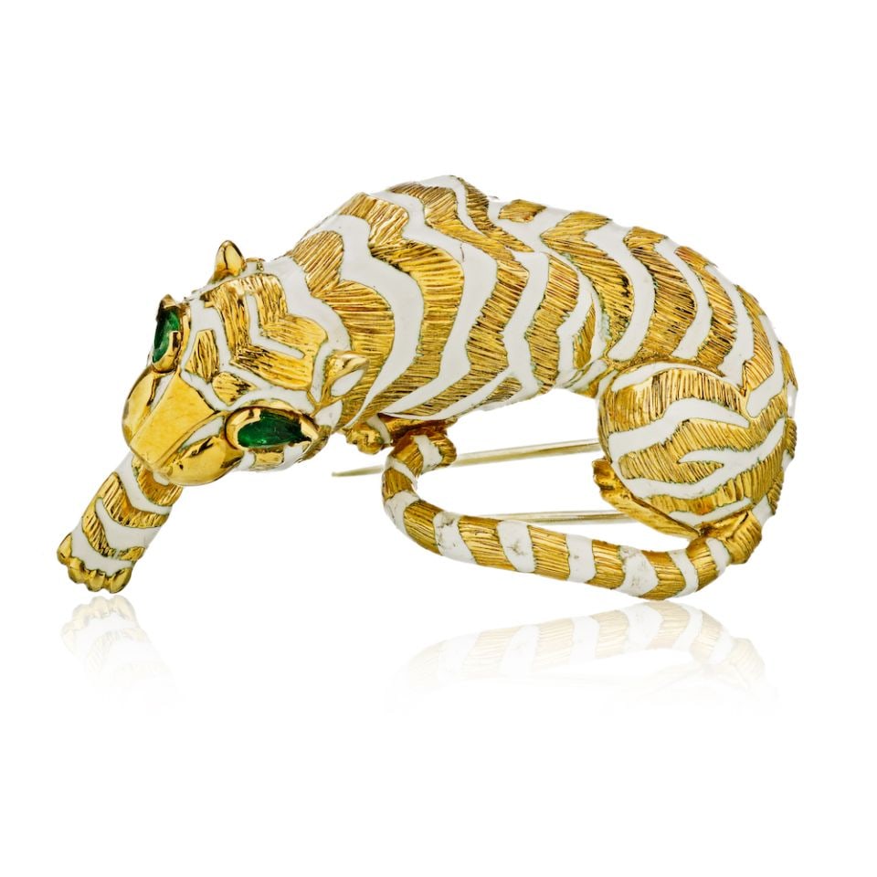 David Webb 18K Gold Tiger Brooch with Emerald Eyes and Enamel: David Webb 18K Gold Tiger Brooch with Emerald Eyes and Enamel Make a bold statement with this striking David Webb brooch, featuring an iconic tiger design crafted from 18K yellow gold. The brooch show