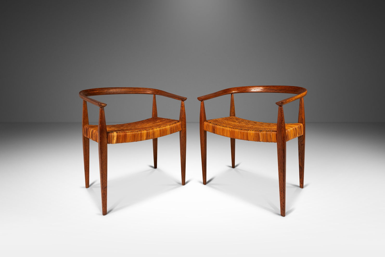 Danish Modern Nanna Ditzel Model 113 Armchairs Set in Oak and Cane: Danish Modern Nanna Ditzel Model 113 Armchairs Set in Oak and Cane This exquisite set of two Model 113 armchairs, designed by the renowned Nanna Ditzel for Kolds Savvaerk, epitomizes Danish Mid-Centur