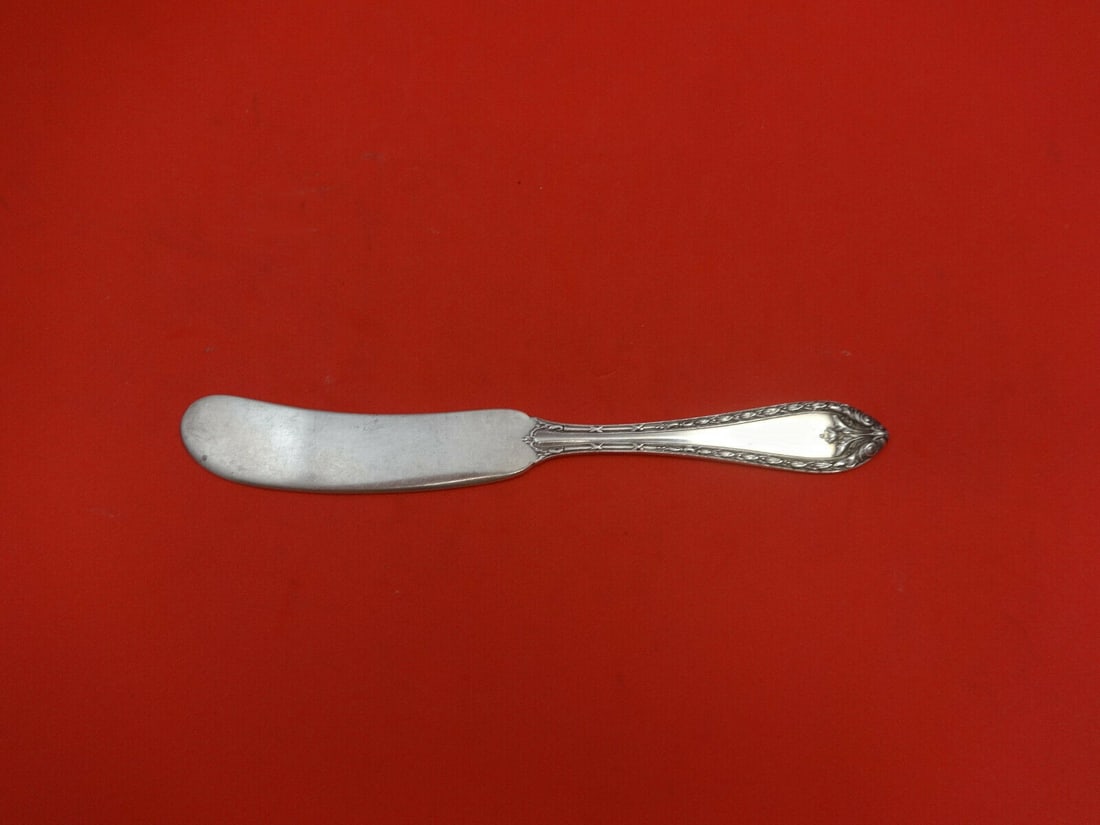 Dominick & Haff Marie Antoinette Sterling Silver Butter Spreader 5 3/4": Dominick & Haff Marie Antoinette Sterling Silver Butter Spreader 5 3/4" This exquisite butter spreader features a flat handle design, crafted in sterling silver and showcasing the elegant "Marie Antoi
