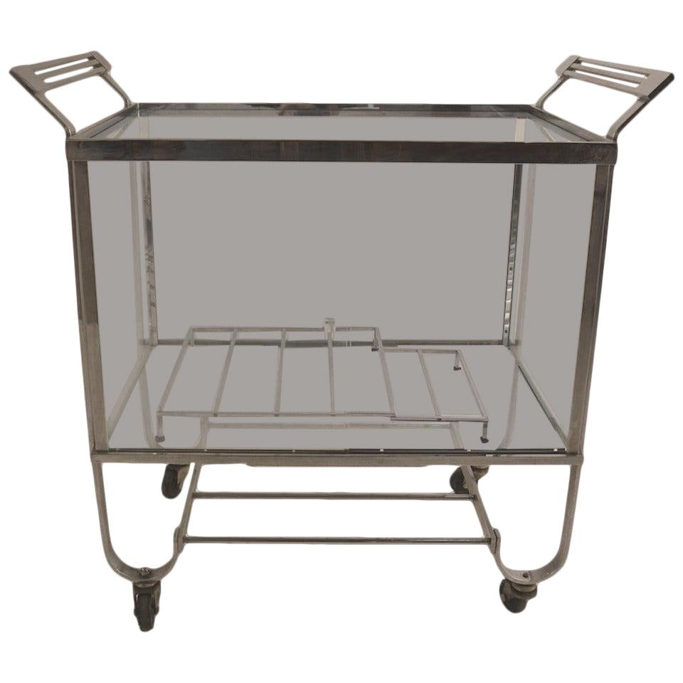 Treitel Gratz 1930s Nickeled Bar Serving Cart with Glass Doors: Treitel Gratz 1930s Nickeled Bar Serving Cart with Glass Doors Introducing the Treitel Gratz Nickeled Bar Serving Cart, a stunning example of Machine Age design from the 1930s. Crafted by the renowned