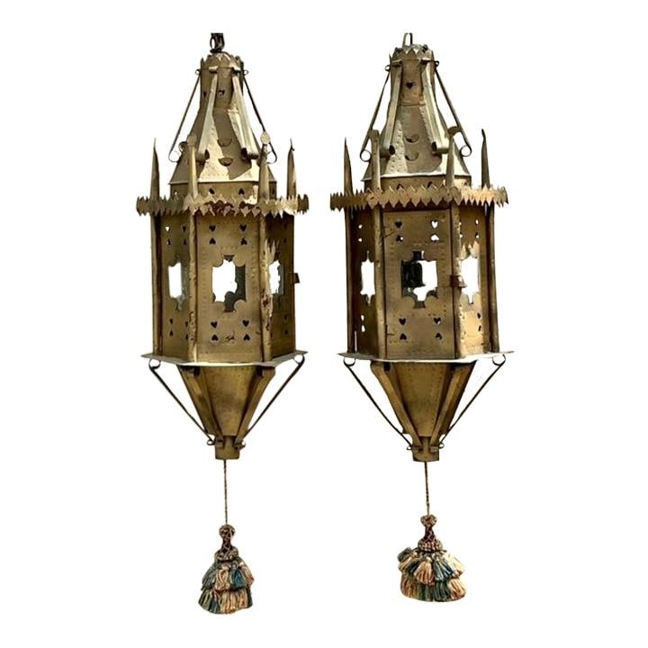 Pair of Vintage Boho Moorish Lanterns Inspired by Addison Mizner: Pair of Vintage Boho Moorish Lanterns Inspired by Addison Mizner Enhance your living space with these stunning Vintage Boho Moorish Lanterns, inspired by the renowned designer Addison Mizner. This exq