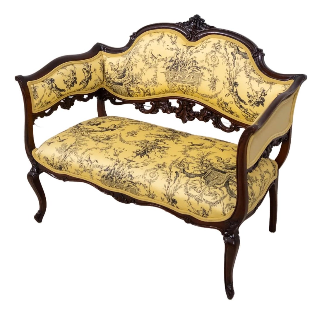 Antique French Louis XV Mahogany Settee with New Toile Upholstery: Antique French Louis XV Mahogany Settee with New Toile Upholstery This exquisite Antique French Louis XV Mahogany Window Bench Settee, dating back to the 1880s, features fine carved details and a high